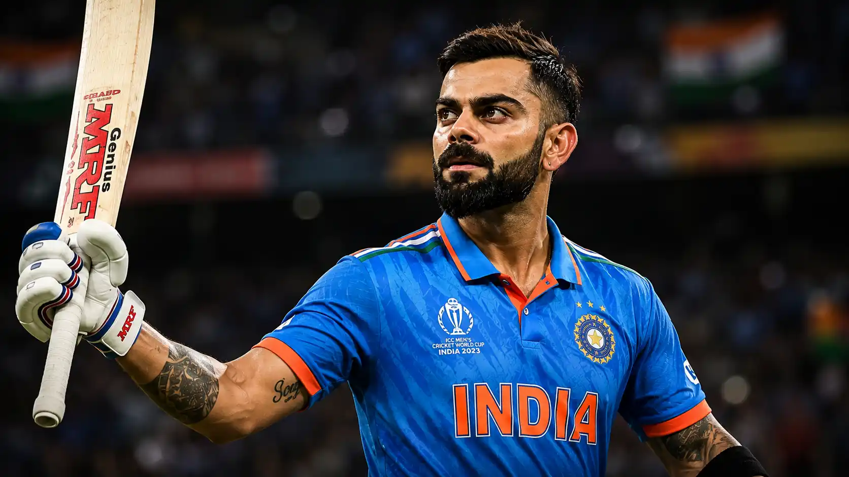 Virat Kohli celebrating with his bat in Team India jersey during an international cricket match at a packed stadium